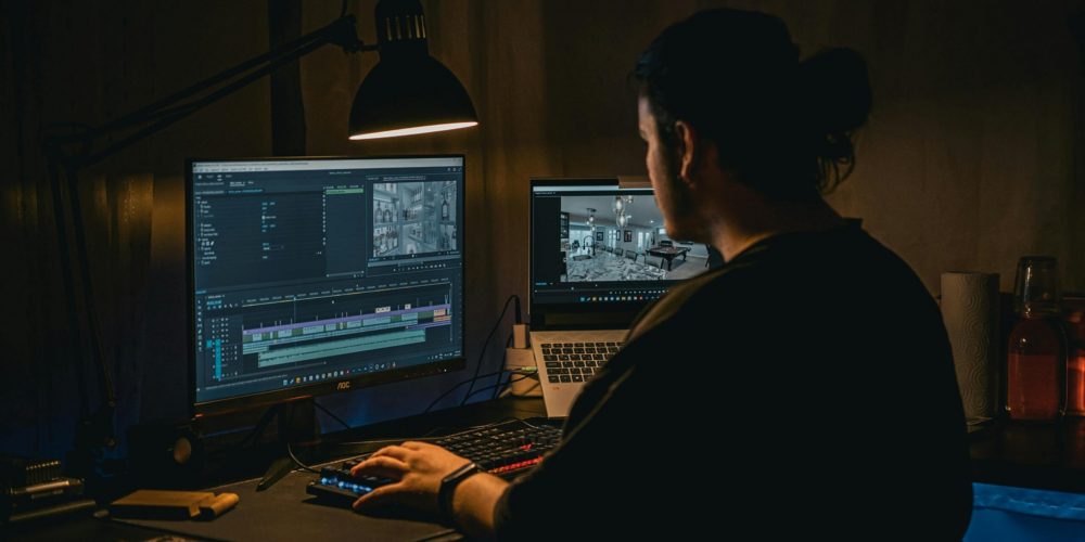 A web designer working on a laptop, showcasing the creative process behind crafting visually stunning and user-friendly websites.